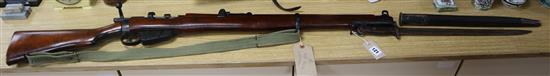 A .303 Royal Enfield replica rifle and a real bayonet length 157cm incl. bayonet